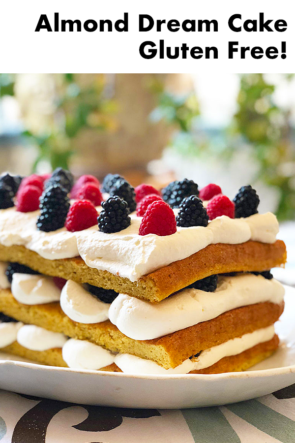 This lovely layer cake is made from light almondy sponge, simple syrup, whipped cream, and fresh berries! It's also naturally gluten-free!