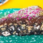 Graham crackers, homemade chocolate sauce, marshmallows, and chocolate ganache unite into a HEAVENLY s'mores no-bake cake!
