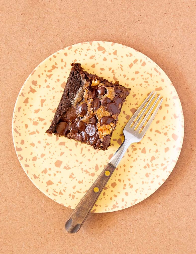 The dates make it so incredibly moist and it even gets better the second day. The star of the cake is undoubtedly the chocolate chip, sugar, and walnut crumble on top. I love that you bake the chocolate chips, yet they retain their shape. Not only does the topping make the cake look mouth-watering, but it also gives it a sweet touch.